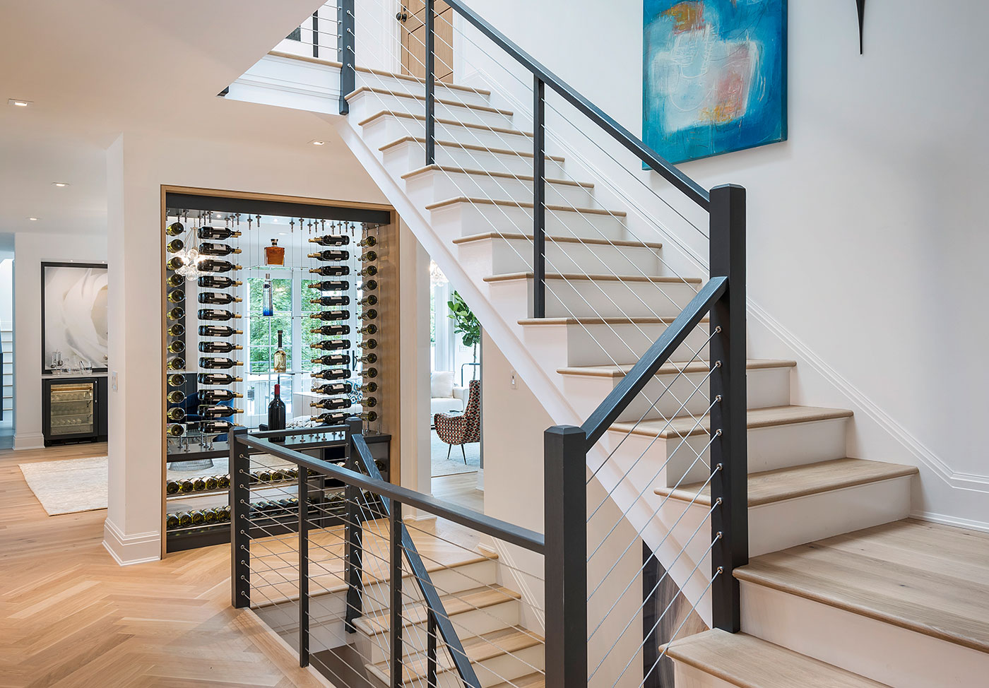 Hardwood floors and three-story staircase.