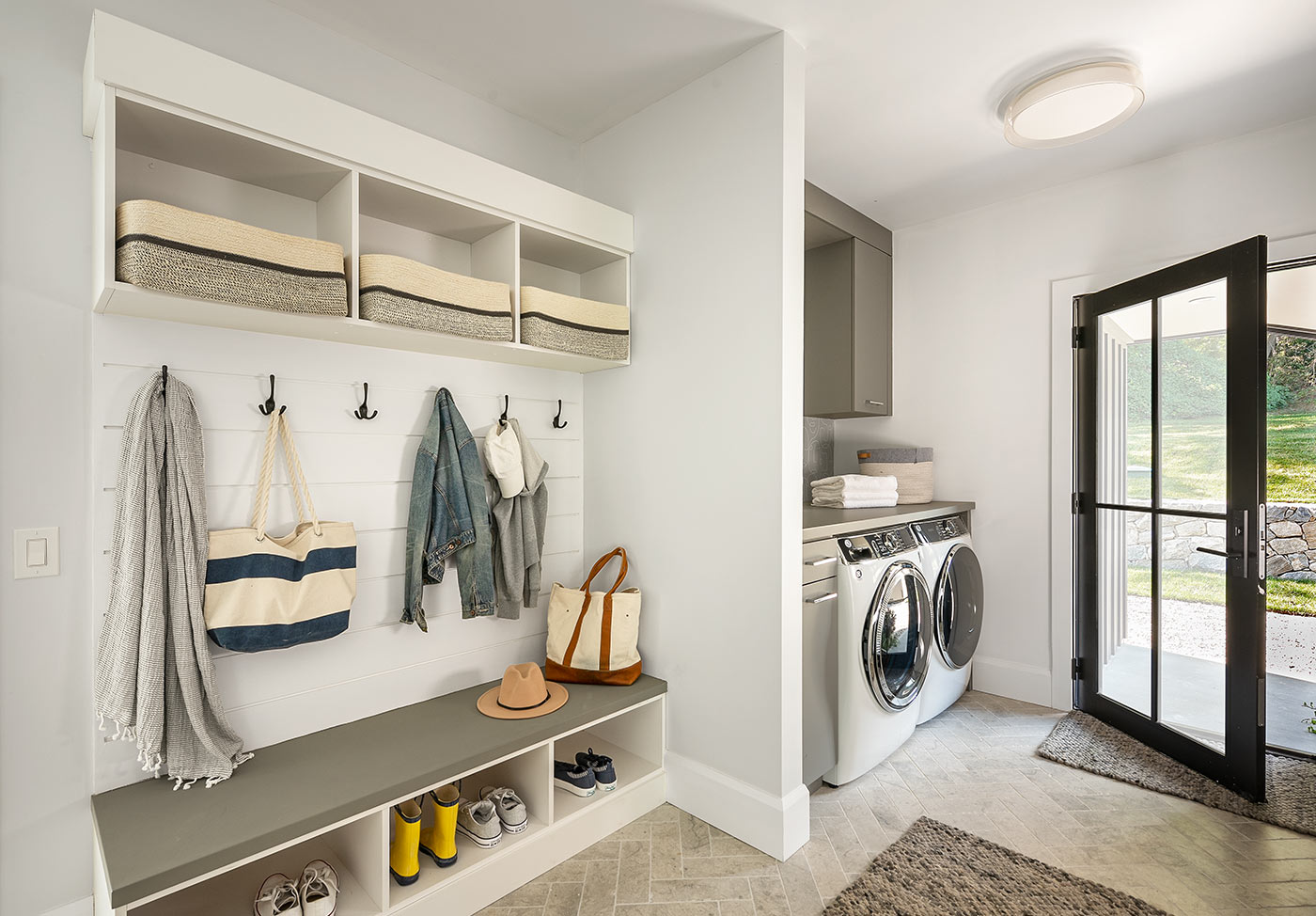 Shiplap wall accent elevates the laundry room.