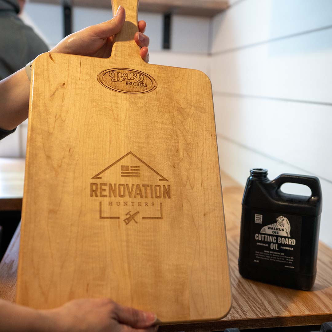 Baird Brothers and Renovation Hunters branded hardwood cutting board.