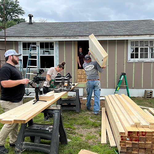 Craftsmen and DIY-ers on the job site for The Outdoor Channel’s first renovation show.