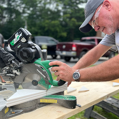Steve Stack trimming hardwood on set at Renovation Hunters’ Tionesta project.