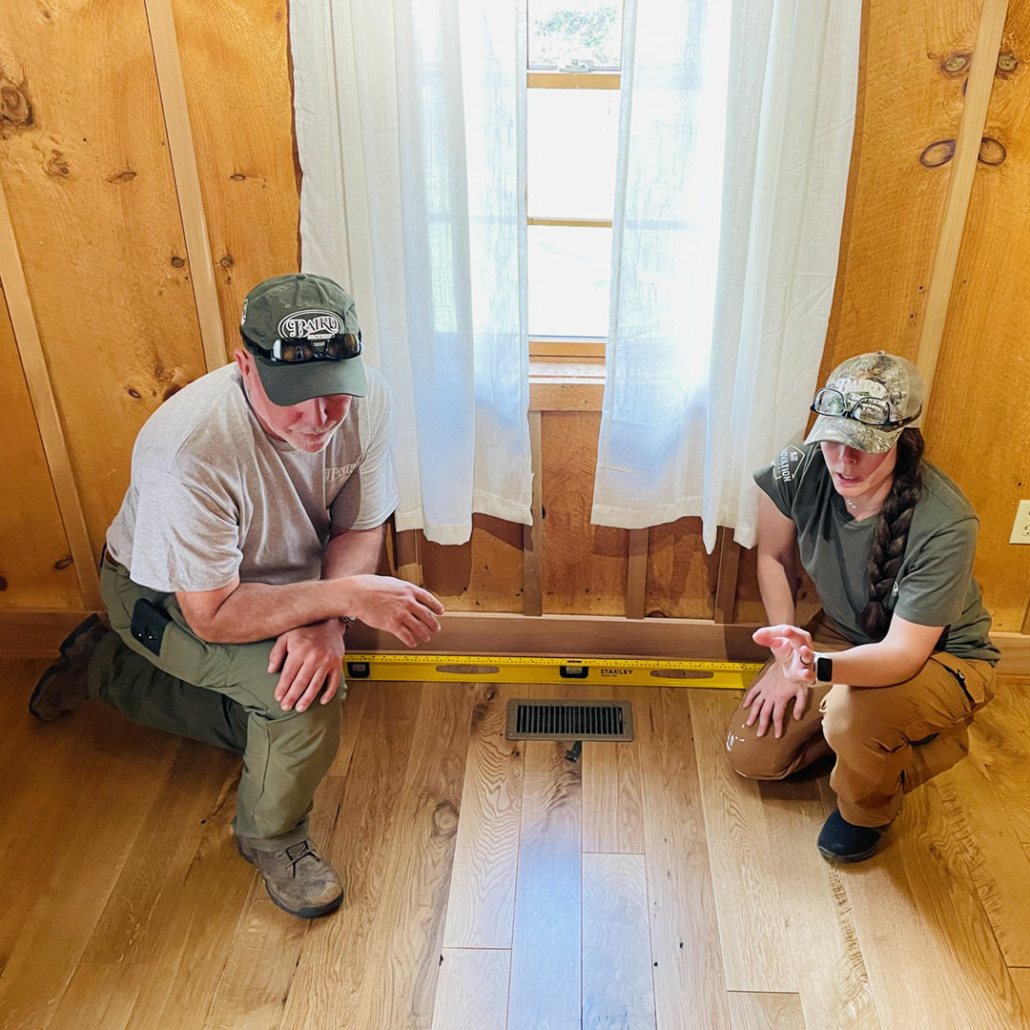 Leveling hardwood floors for a log home owner.