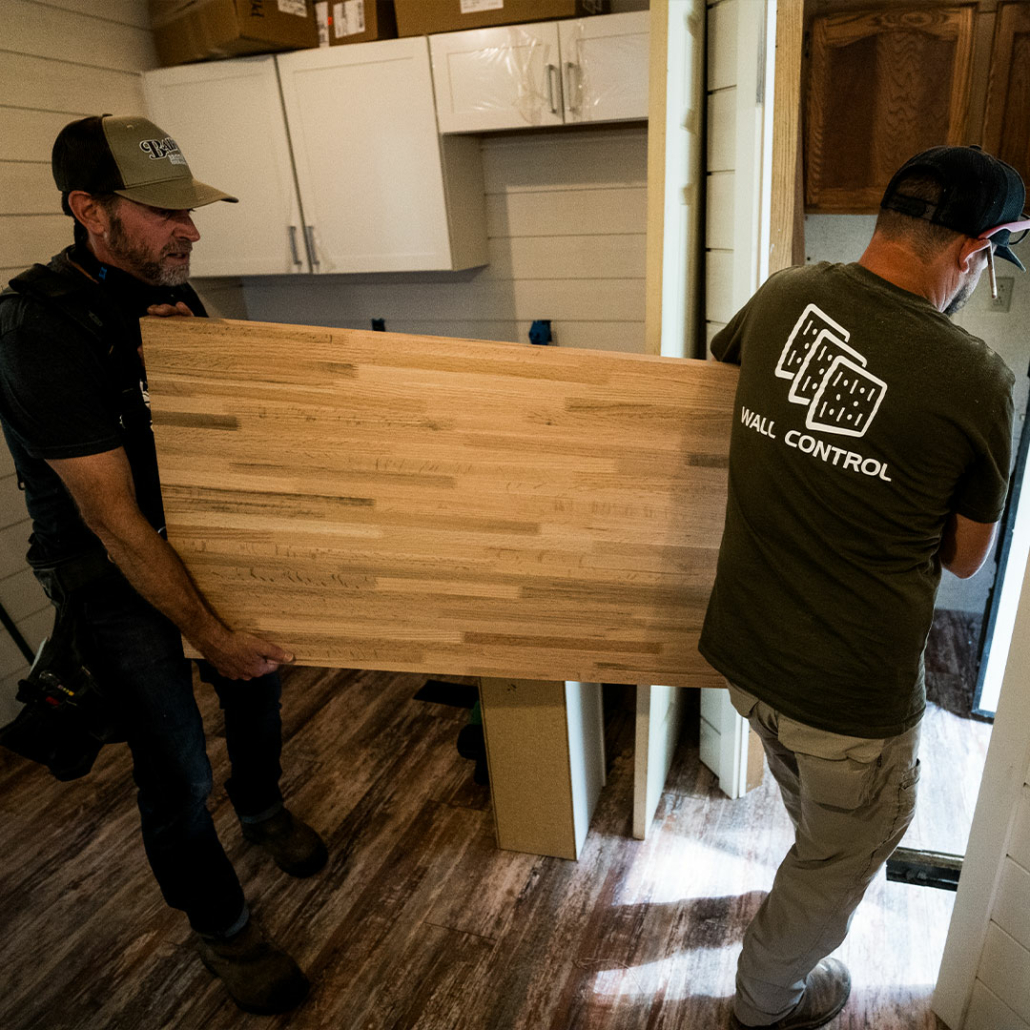 Carrying in a new kitchen countertop for a mobile home kitchen remodel.