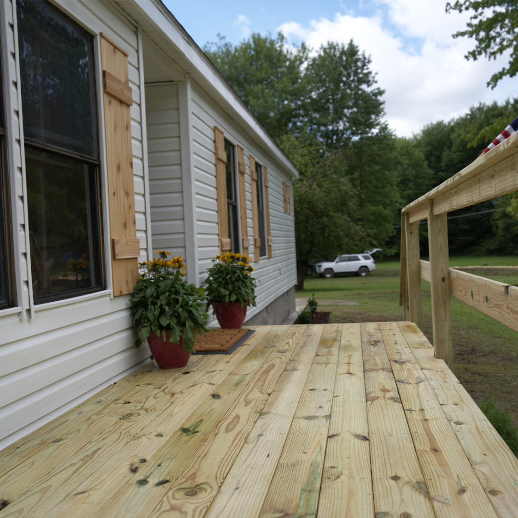 Wooden deck as part of Renovation Hunters’ mobile home makeover.